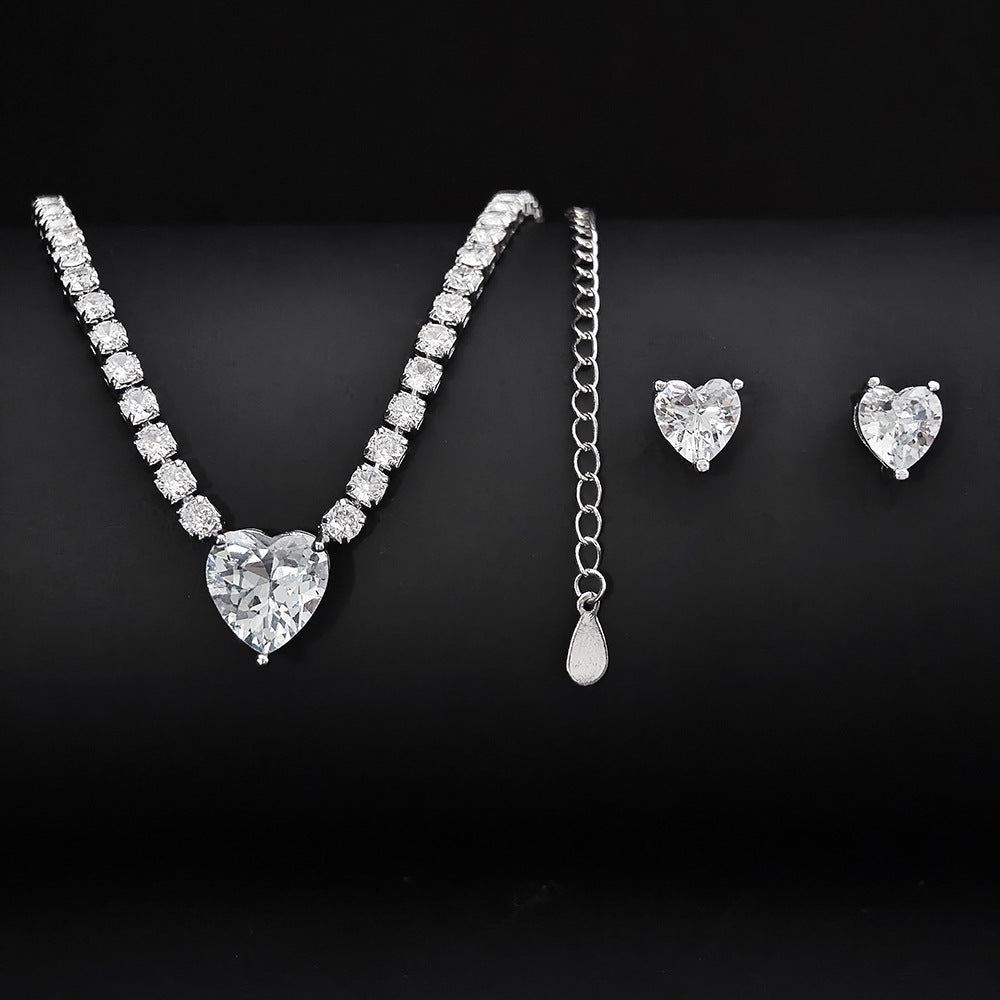 Elegant two-piece jewelry set featuring a gold necklace and matching earrings, perfect for weddings and special occasions

