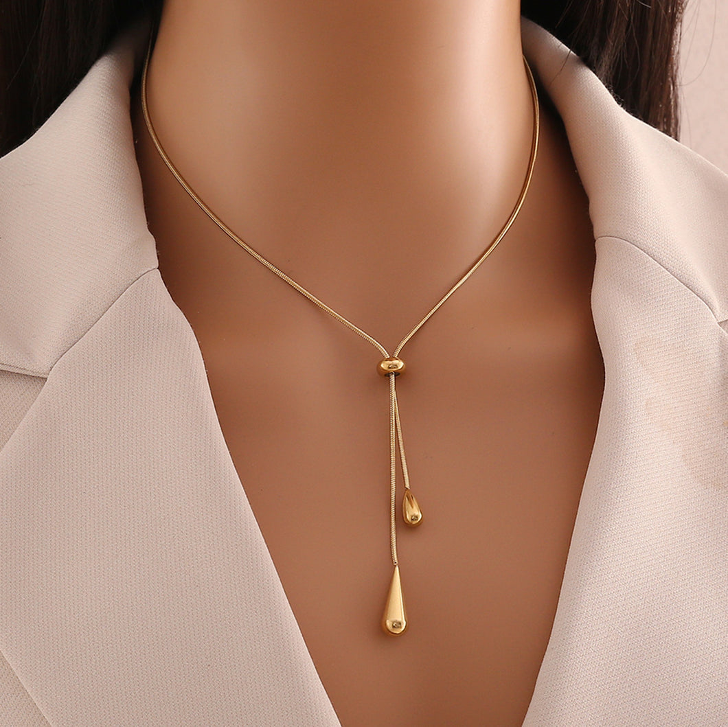 women's tassel necklace
gold water drop necklace
luxury statement jewelry
elegant pendant necklace
fashionable women's accessories
designer tassel jewelry
chic water drop pendant
high-end women's necklace
trendy tassel pendant
sophisticated gold necklace