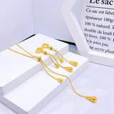 designer tassel jewelry
chic water drop pendant
high-end women's necklace
trendy tassel pendant
sophisticated gold necklace