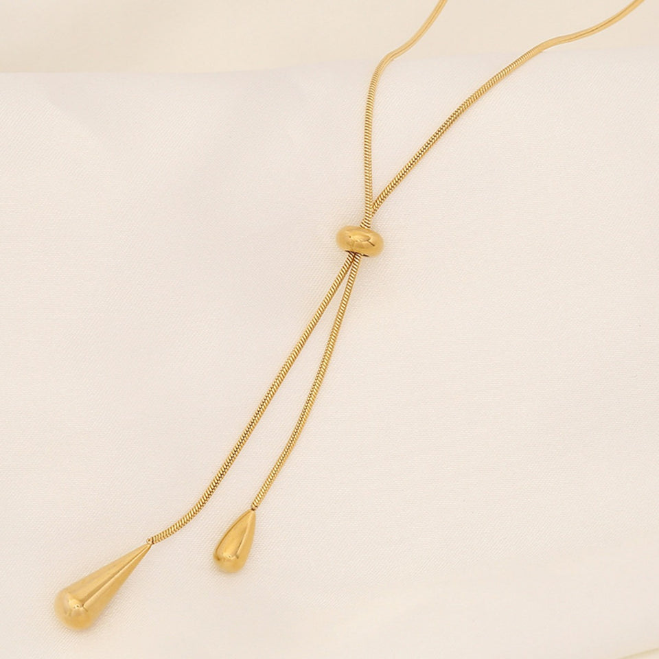 Elegant Women's Gold Water Drop Tassel Necklace. women's tassel necklace
gold water drop necklace
luxury statement jewelry
elegant pendant necklace
fashionable women's accessories
designer tassel jewelry