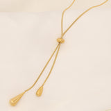 Elegant Women's Gold Water Drop Tassel Necklace. women's tassel necklace
gold water drop necklace
luxury statement jewelry
elegant pendant necklace
fashionable women's accessories
designer tassel jewelry